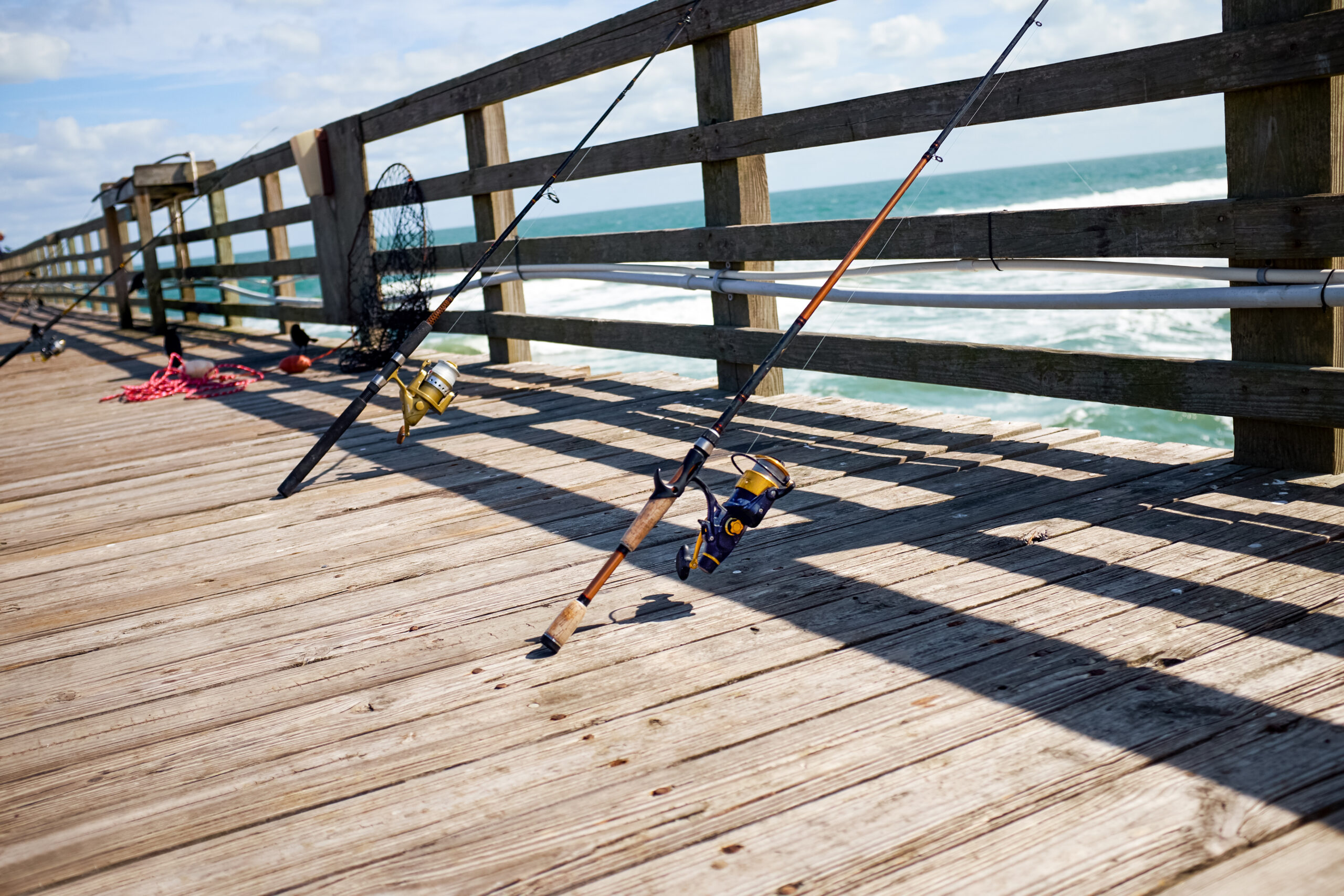Fishing pier and boat docks on the bay at Marlin Arms, South Padre Island.