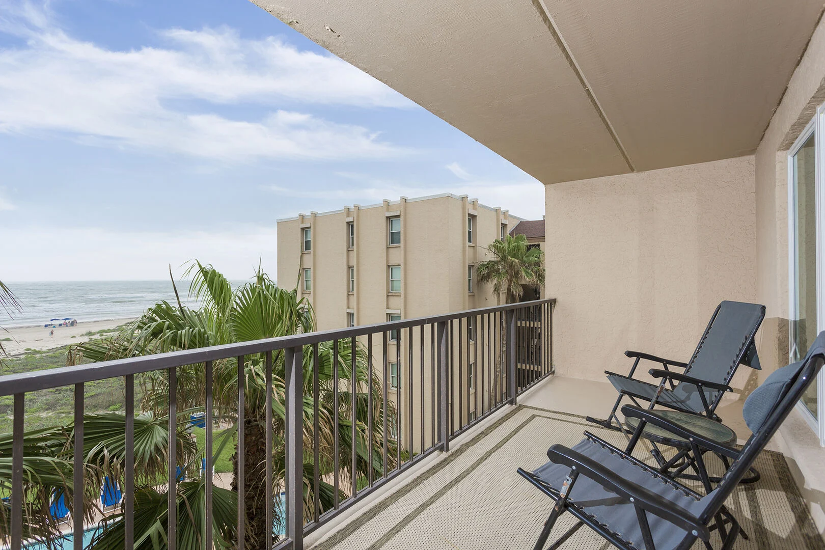 View from a Beach House Condominiums balcony looking down the South Padre Island beach.
