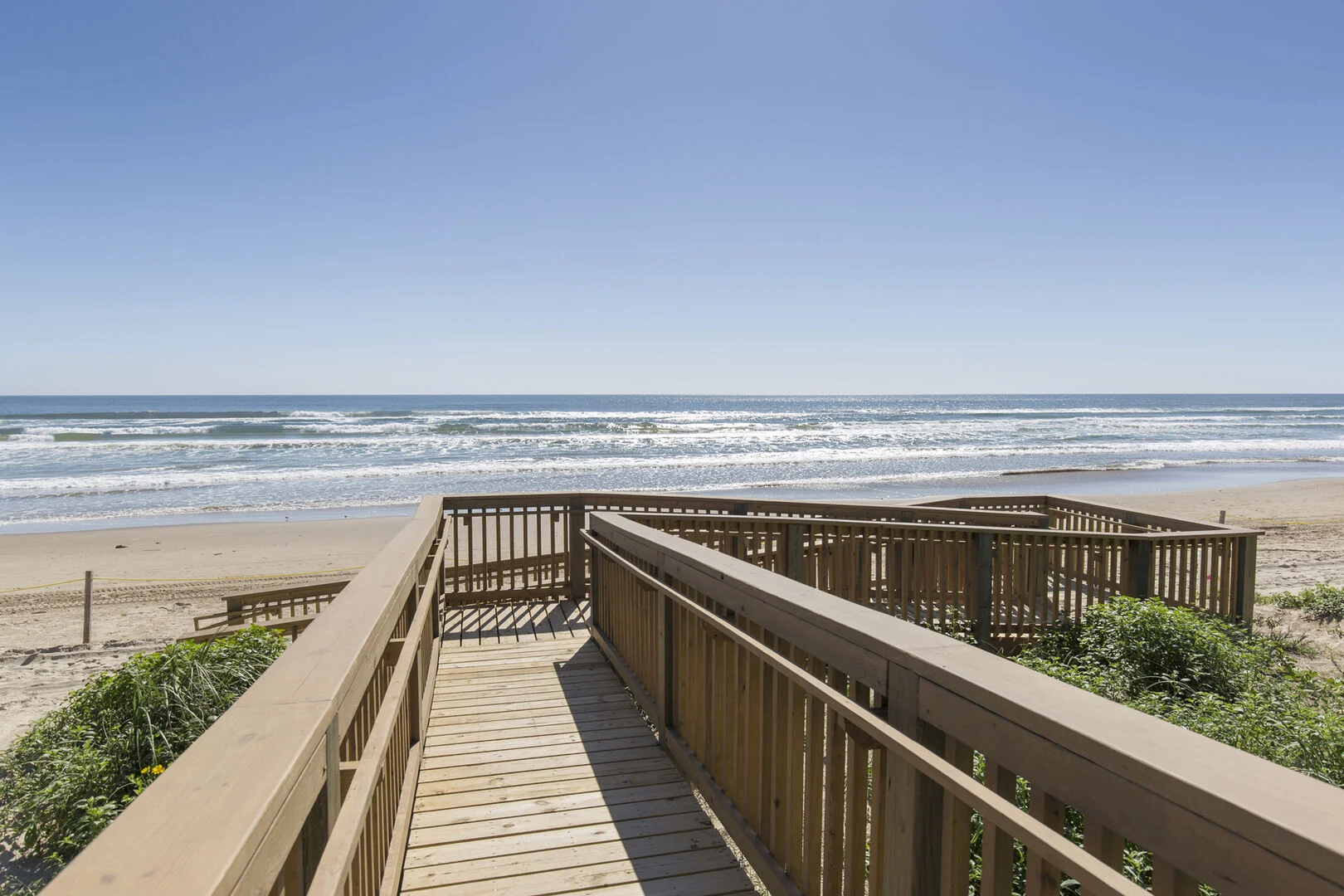 Guests using a private community walkway onto the South Padre Island beach.